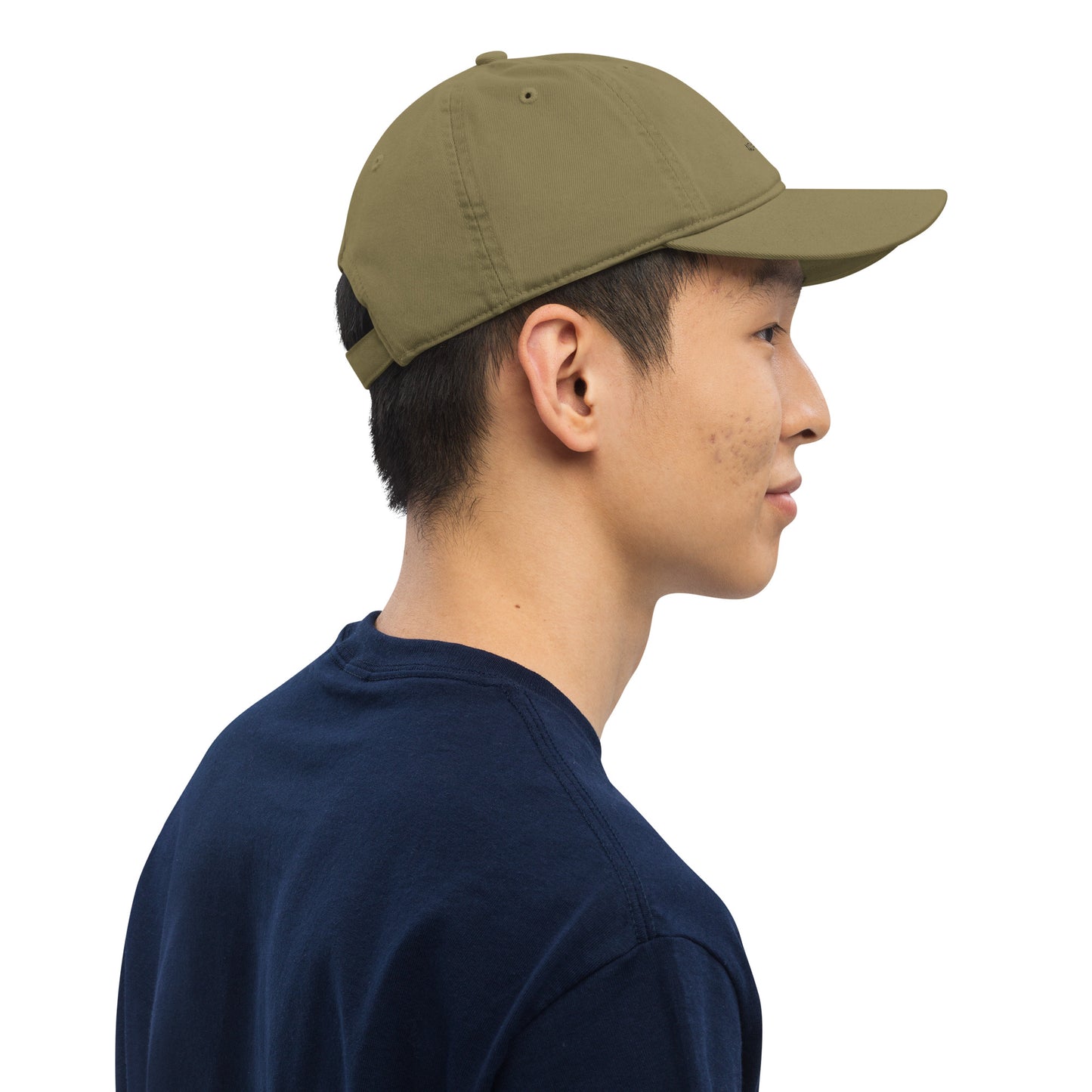 Model wearing the forest green Novapuro Signature Organic Cap made from sustainable cotton