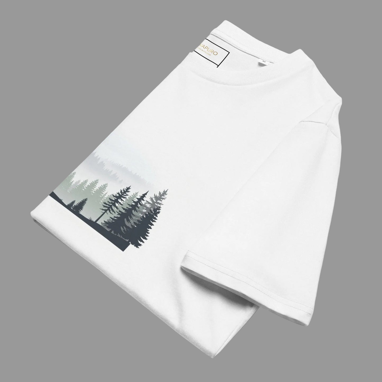Folded white Novapuro Misty Pines eco-friendly t-shirt highlighting the minimalist forest print.