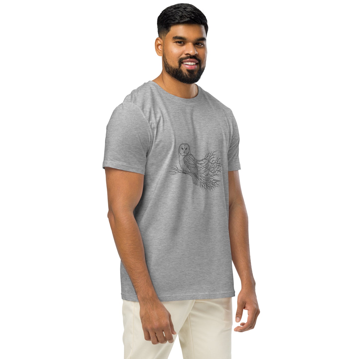Lifestyle shot of a person wearing the sustainable Novapuro Nordic owl organic cotton t-shirt in heather grey.