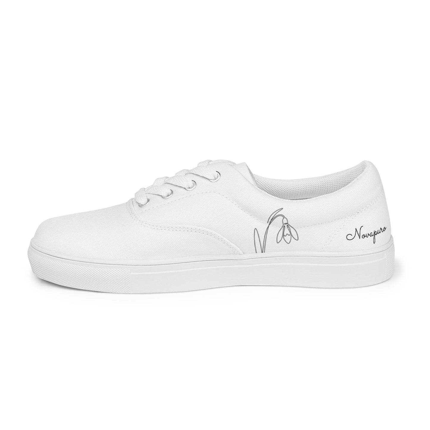Minimalist white women's canvas sneakers with black First Bloom snowdrop design by Novapuro