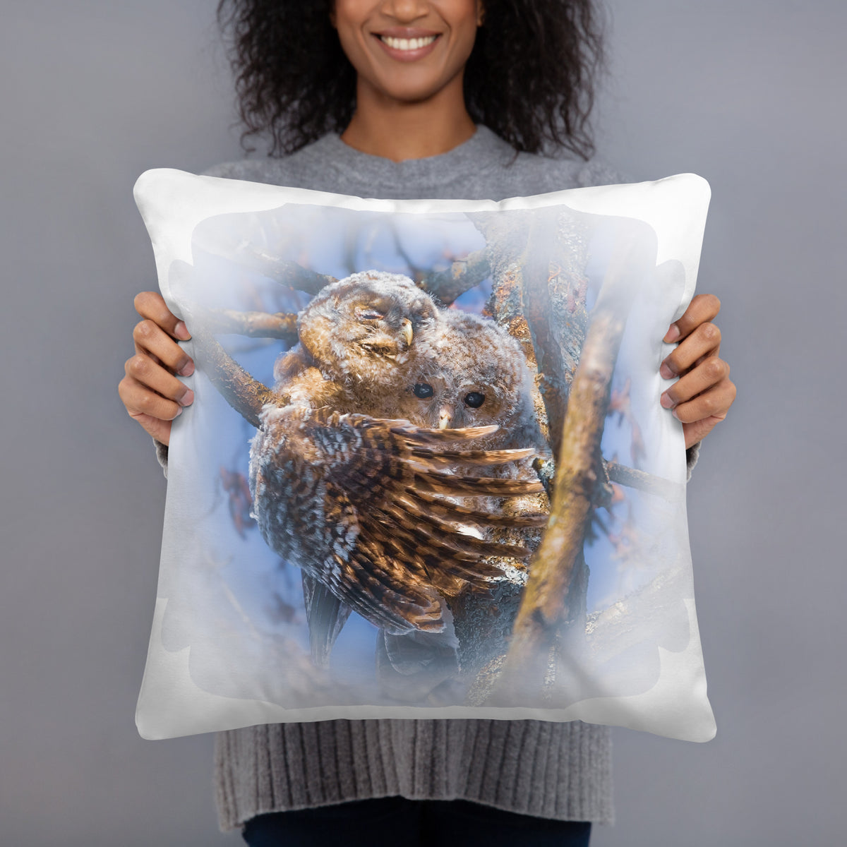 Novapuro x Auli Leivonen decorative throw pillow featuring a Nordic tawny owl duo nature design, resting on a cozy bed.