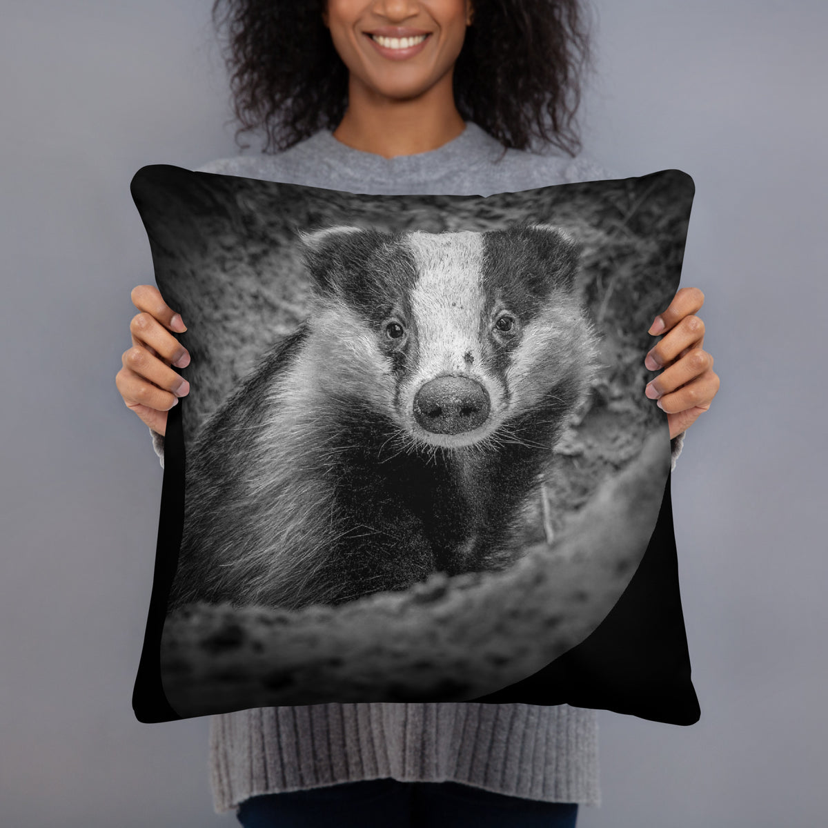 A soft throw pillow featuring a stunning Nordic badger design, a nature-inspired home decor collaboration between Novapuro and Auli Leivonen.