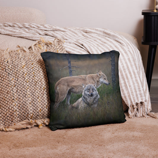 Premium throw pillow featuring the 'Leaders of the Pack' alpha wolf couple design by Auli Leivonen, styled in a cozy room. Scandinavian nature-inspired home decor.   