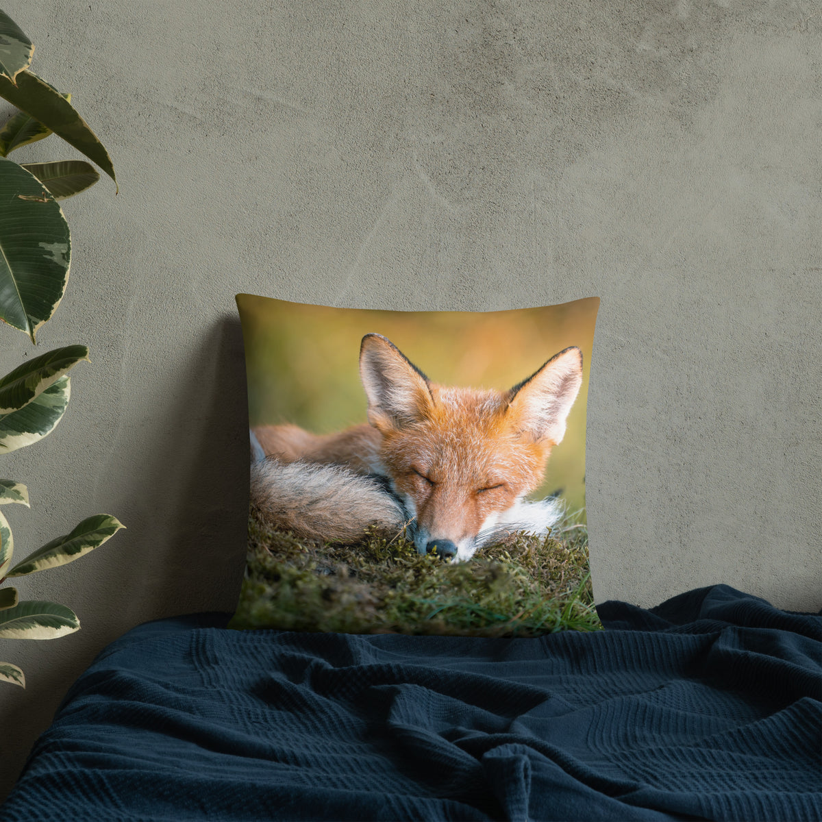 A stylish premium throw pillow featuring an original photograph of a resting red fox by Mikko Monto, placed in a cozy home setting