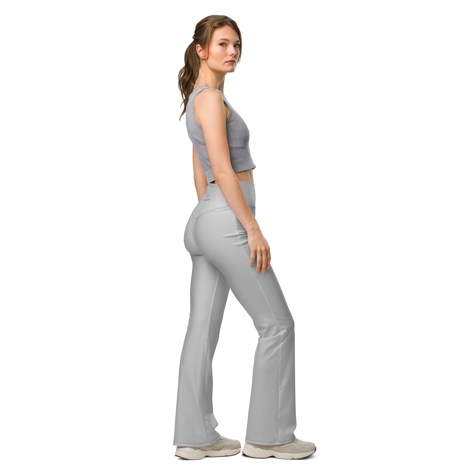 Side view of grey flare leggings with flexible recycled fabric for active movement
