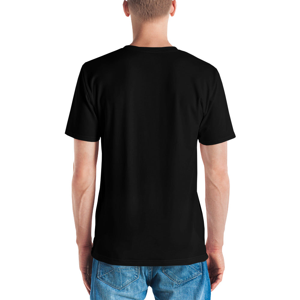 A man wearing the black Novapuro x Jarno Virtanen premium men's t-shirt featuring a Nordic long-eared owl chick print on the lower side.