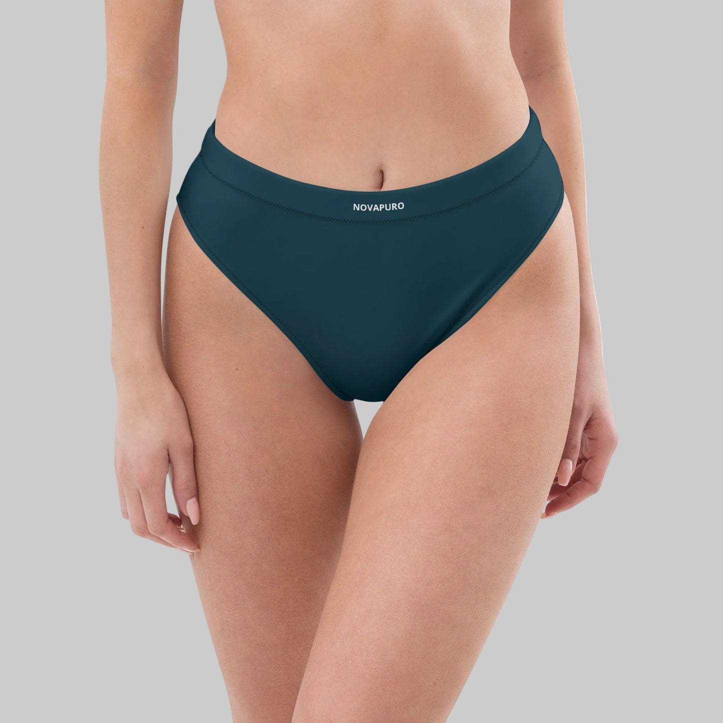 Dark blue Novapuro Signature recycled high-waisted bikini bottom on a model