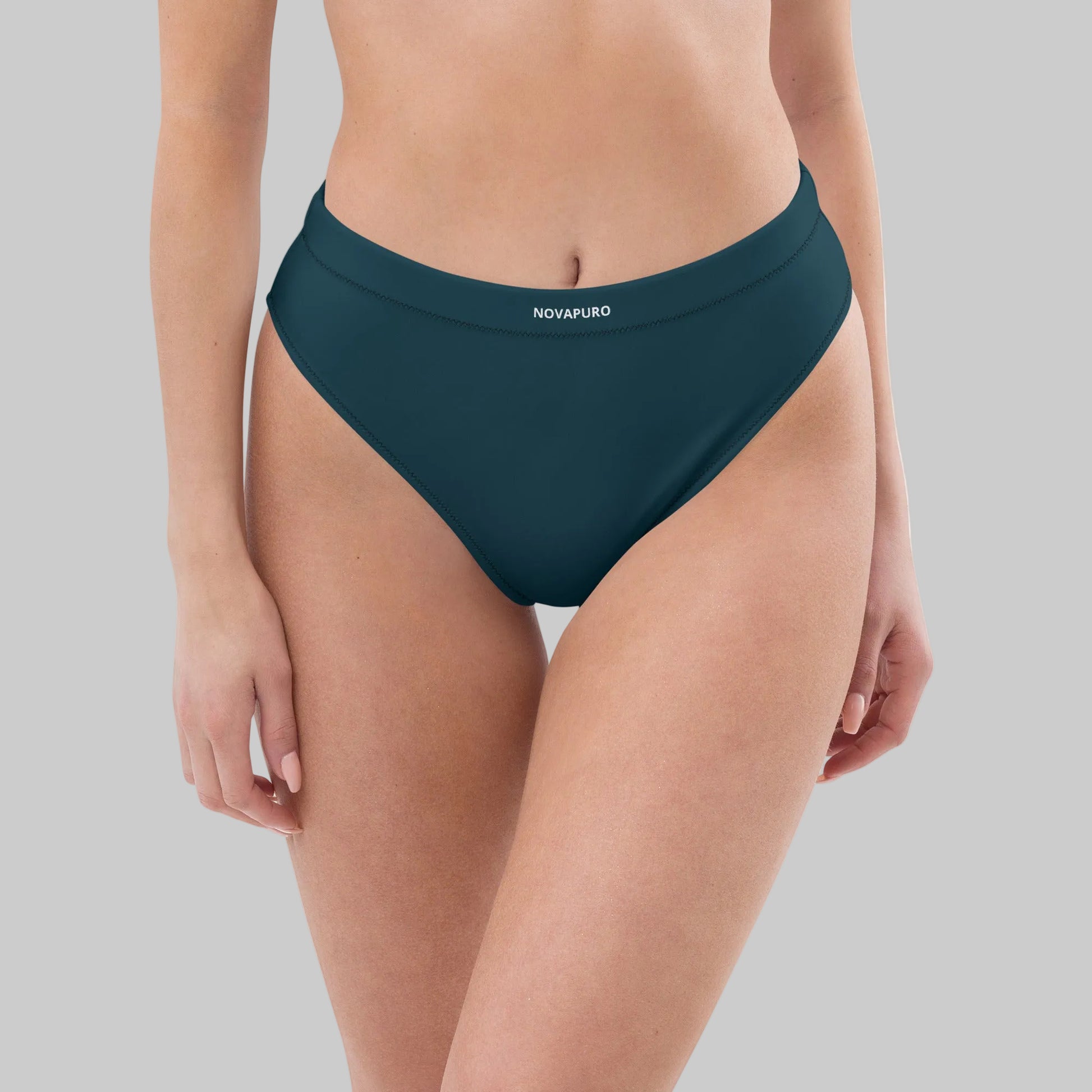 Dark blue Novapuro Signature recycled high-waisted bikini bottom on a model