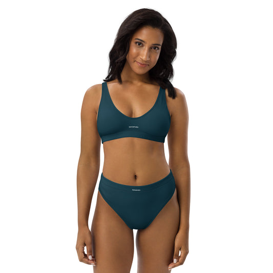Model wearing dark blue Novapuro Signature recycled bikini set