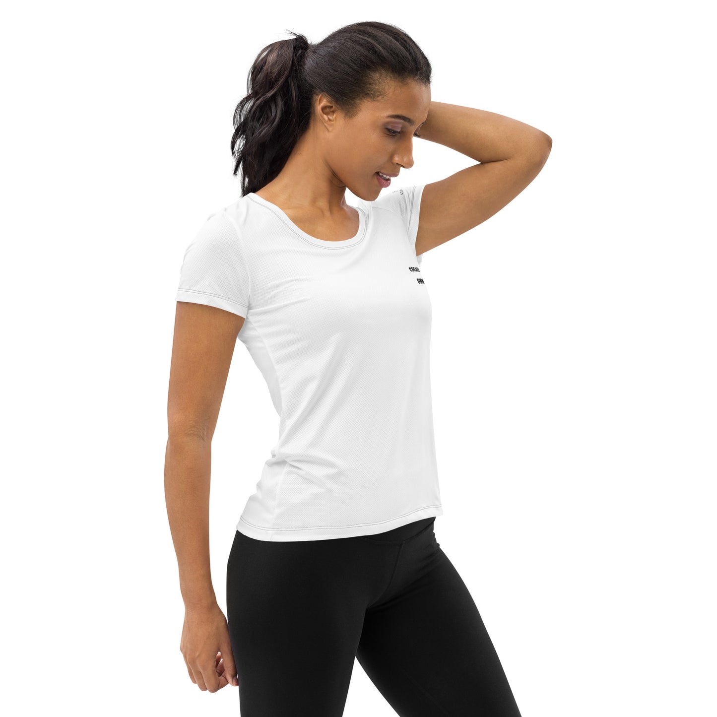 Woman wearing white Novapuro athletic t-shirt with Create Your Own Pace text, minimalist activewear design