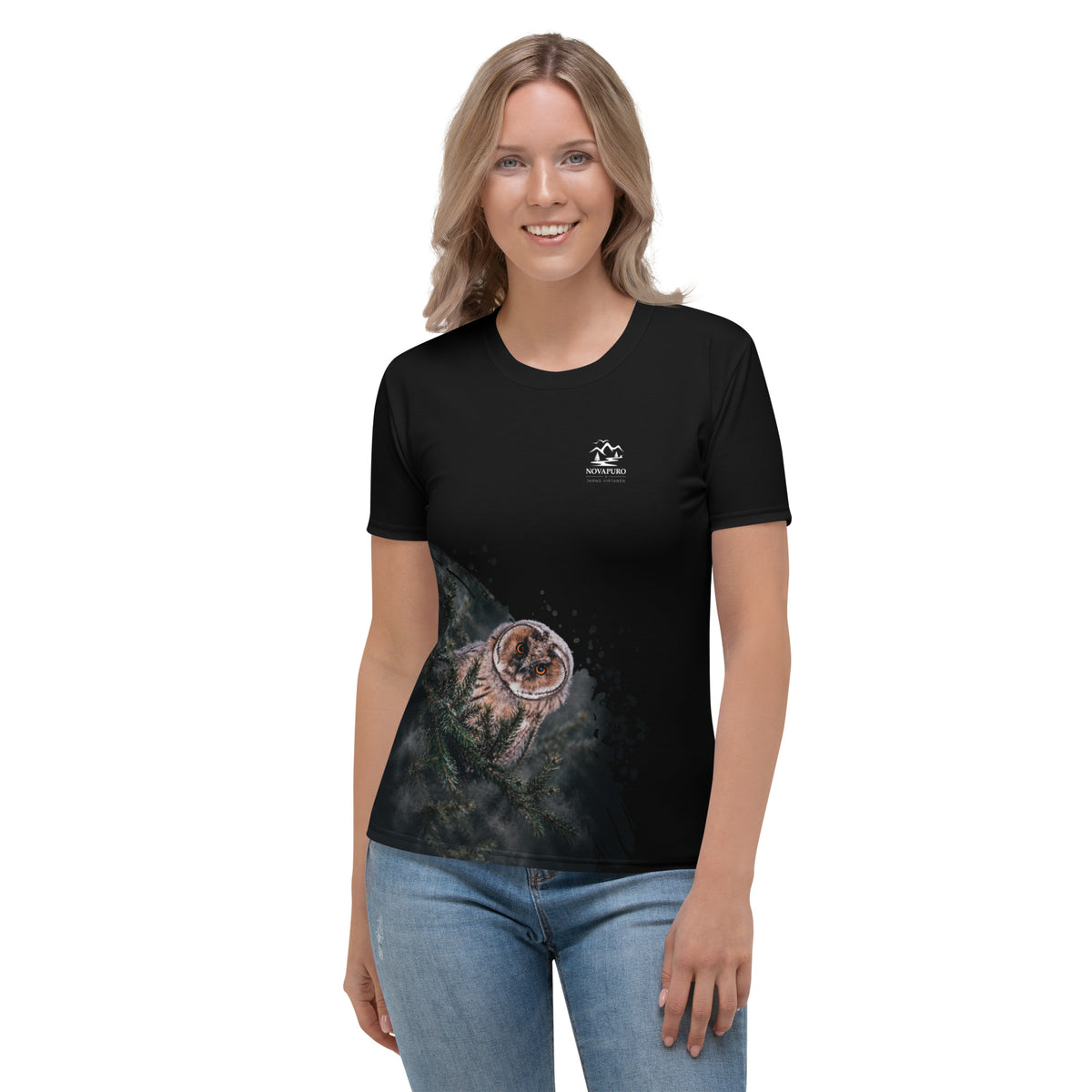 A woman wearing the black Novapuro x Jarno Virtanen women's t-shirt featuring a Nordic long-eared owl chick print on the lower side.
