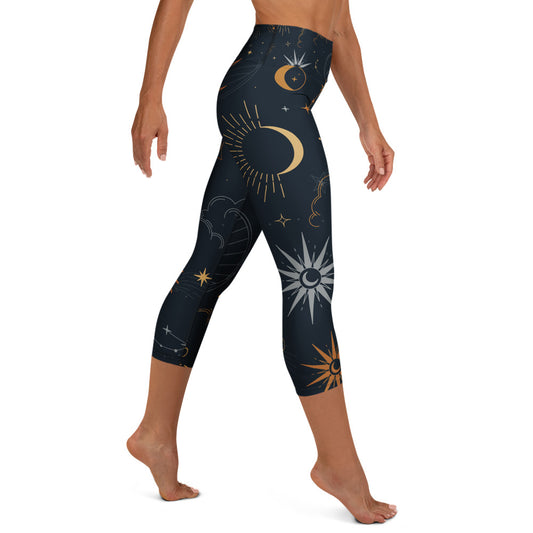 Woman practicing yoga in comfortable high-waisted celestial capri leggings with moon pattern
