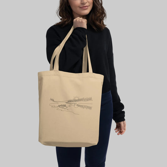 Novapuro Midnight Lake organic cotton tote bag featuring a minimalist continuous line drawing of a Nordic lake