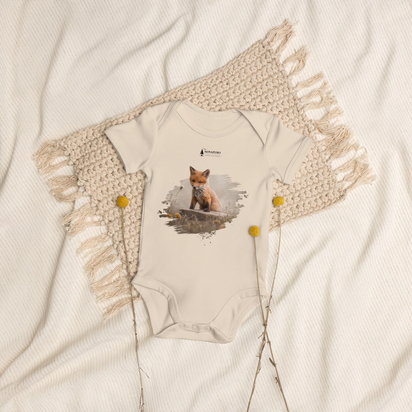 Organic cotton baby bodysuit in natural white featuring an authentic Guardian Fox Kit wildlife illustration by Novapuro x Jarno Virtanen, styled flat lay