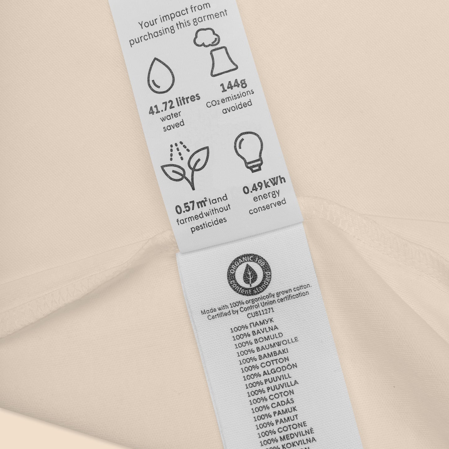 Close-up of the custom inside neck label on the Novapuro x Jarno Virtanen 100% organic cotton baby bodysuit