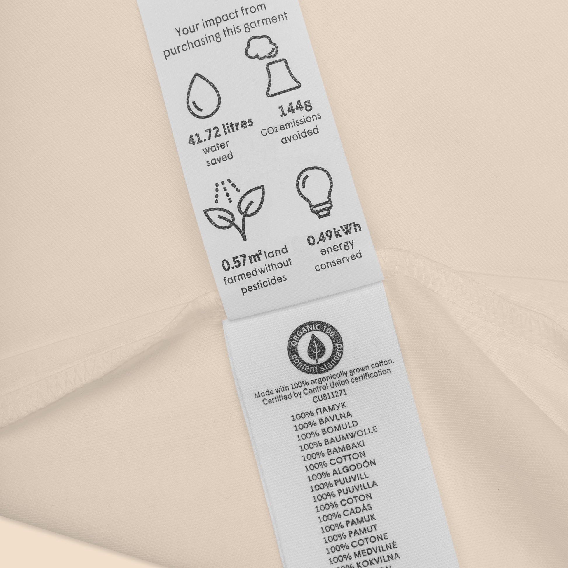 Close-up of the custom inside neck label on the Novapuro x Jarno Virtanen 100% organic cotton baby bodysuit