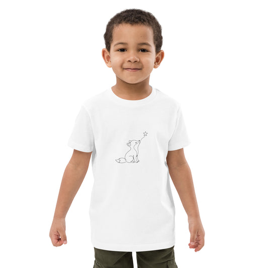 White organic cotton kids t-shirt worn by a young boy, featuring a minimalist black continuous line art of a small fox looking up at a star.