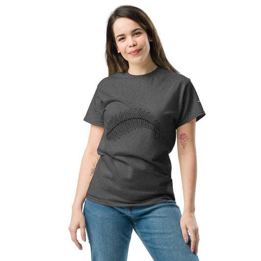 Woman wearing a dark heather grey Novapuro Classic Fern t-shirt with a minimalist fern graphic on the front.