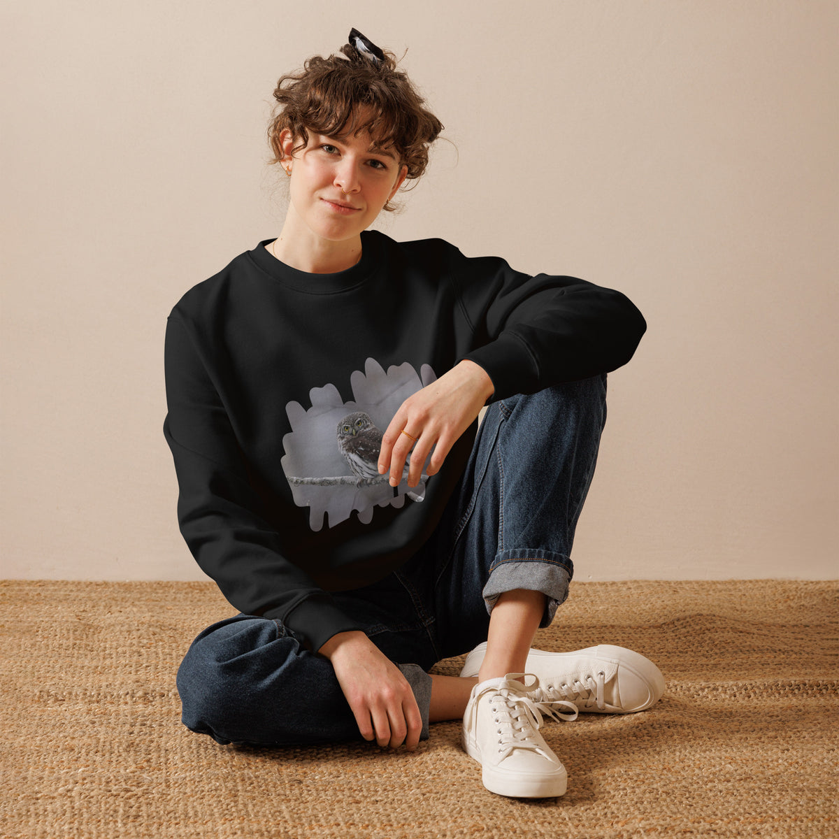 Premium black organic cotton eco sweatshirt featuring a fine art nature photograph of a Nordic Eurasian Pygmy Owl from the Tarja x Novapuro collection.
