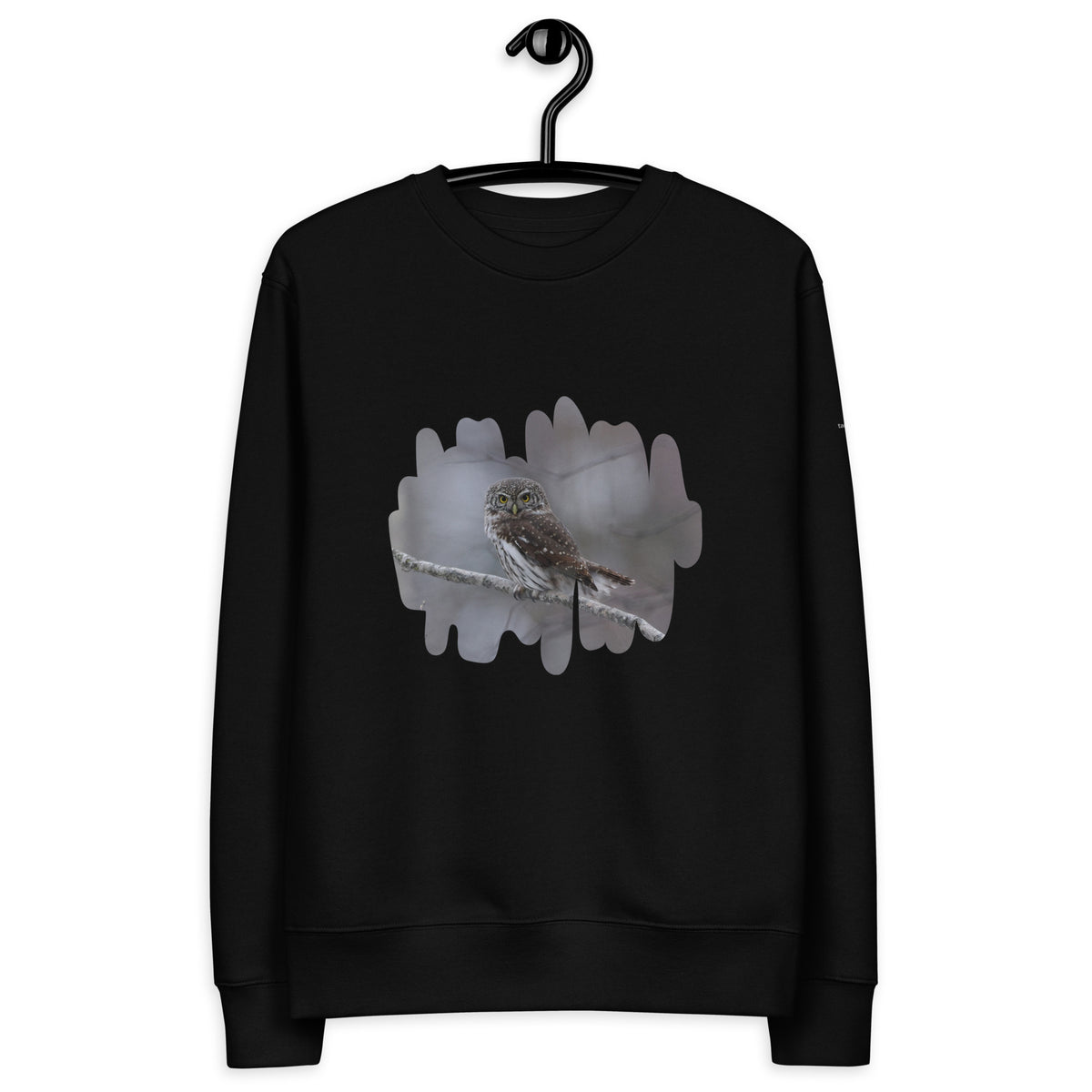 Premium black organic cotton eco sweatshirt featuring a fine art nature photograph of a Nordic Eurasian Pygmy Owl from the Tarja x Novapuro collection.