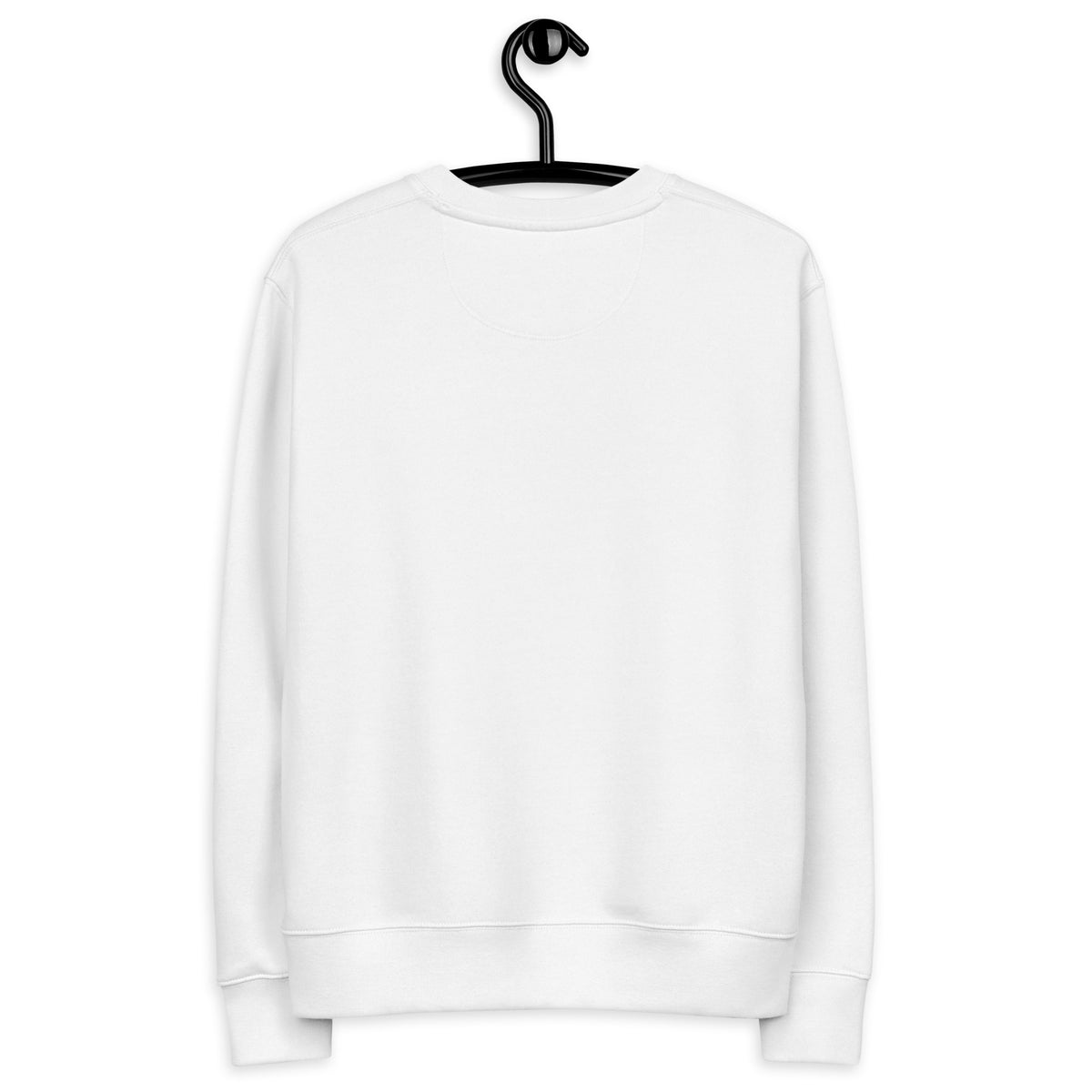 A man standing in a misty Nordic pine forest wearing a sustainable white organic cotton sweatshirt featuring a minimalist bear silhouette design.