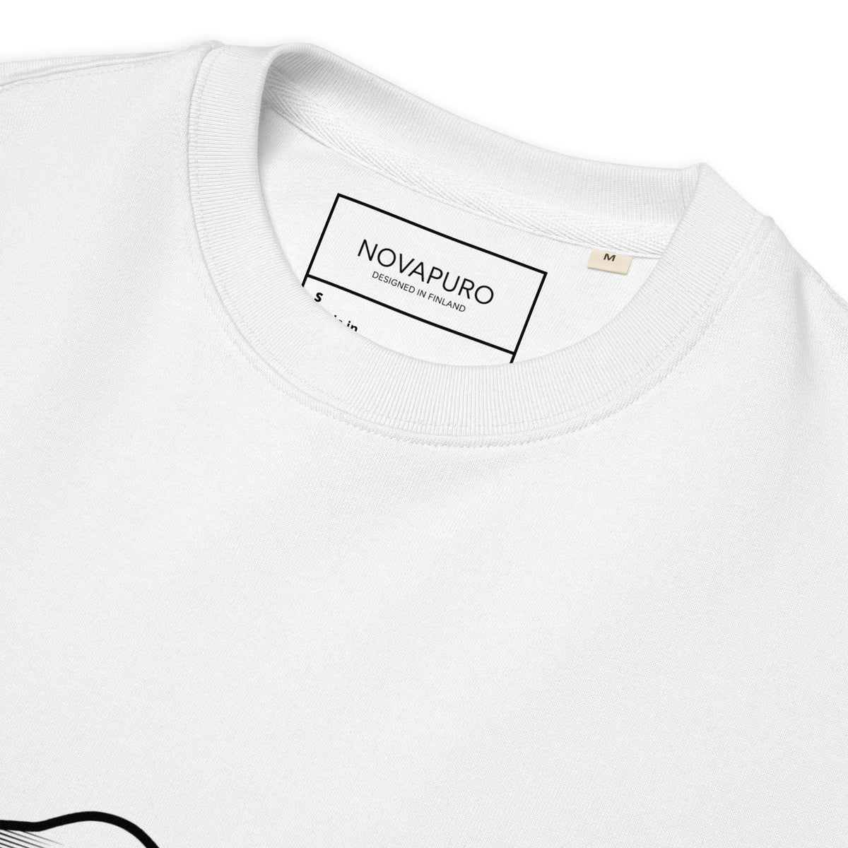 A man standing in a misty Nordic pine forest wearing a sustainable white organic cotton sweatshirt featuring a minimalist bear silhouette design.