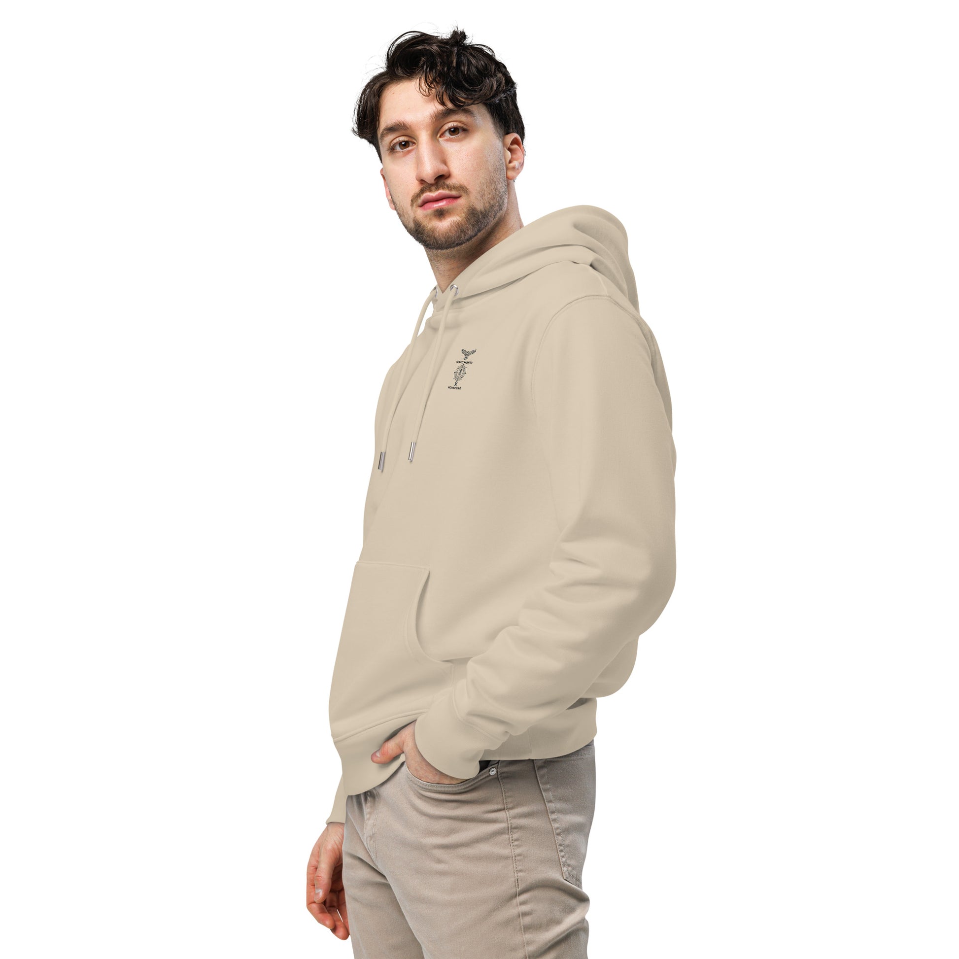 Front view of a model wearing a sand-colored organic hoodie with the Novapuro x Mikko Monto collaboration logo.