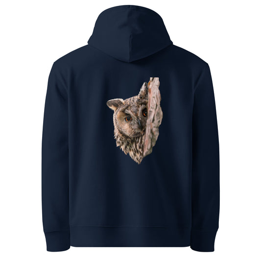 Front view of a model wearing a black organic hoodie featuring a stippling art print of a Long-eared Owl by Mikko Monto.