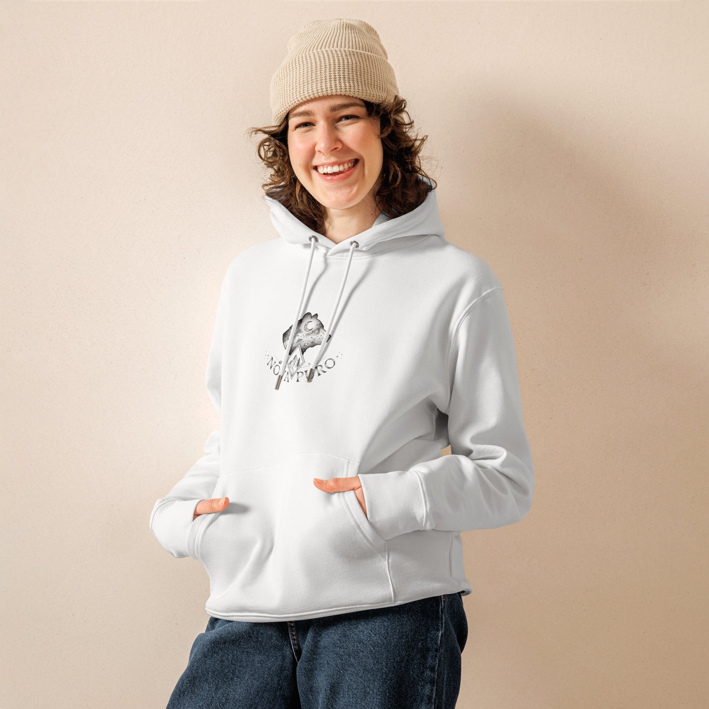 Model wearing the comfortable white Cosmic Bear organic cotton hoodie. Sustainable Nordic lifestyle clothing and eco-friendly fashion.