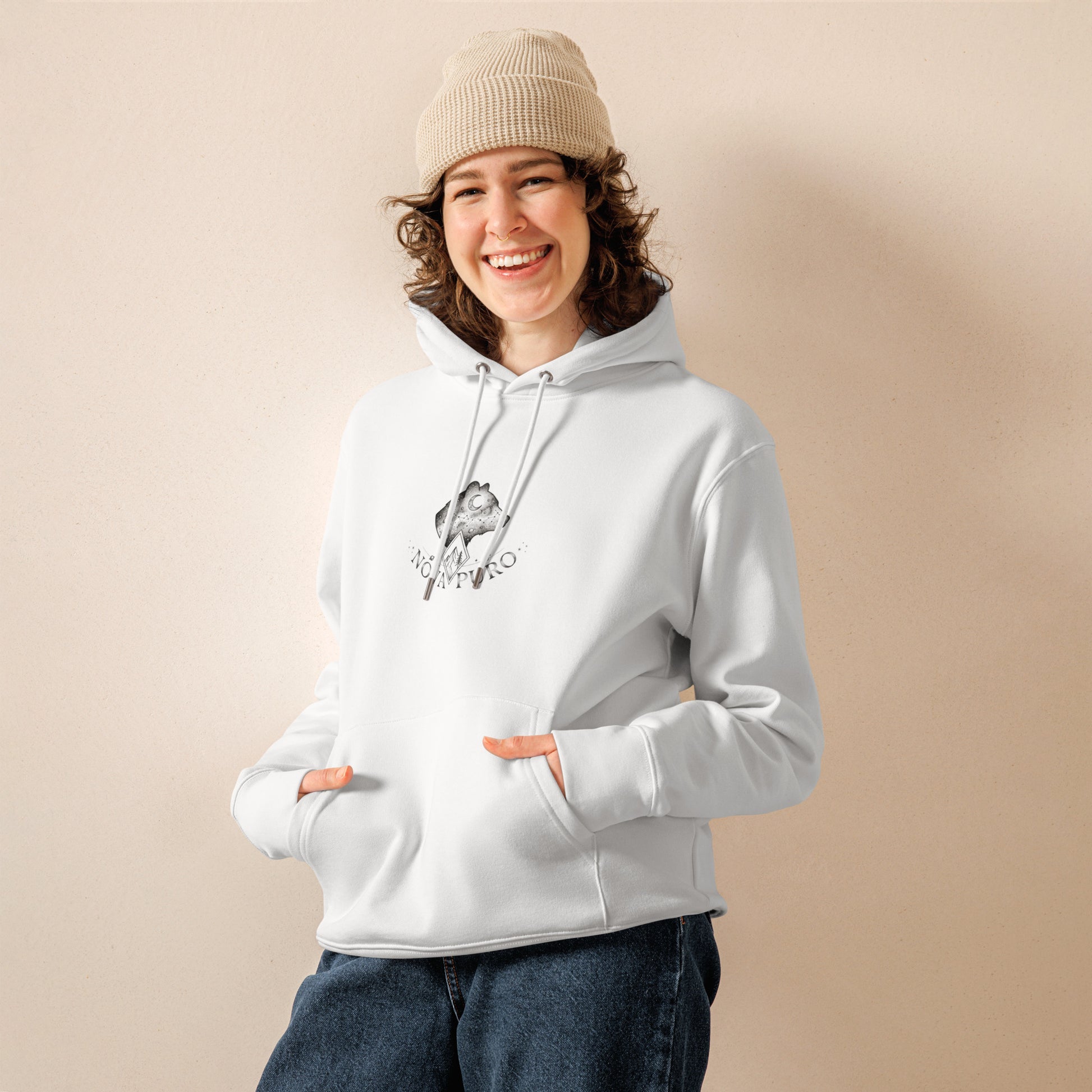 Model wearing the comfortable white Cosmic Bear organic cotton hoodie. Sustainable Nordic lifestyle clothing and eco-friendly fashion.