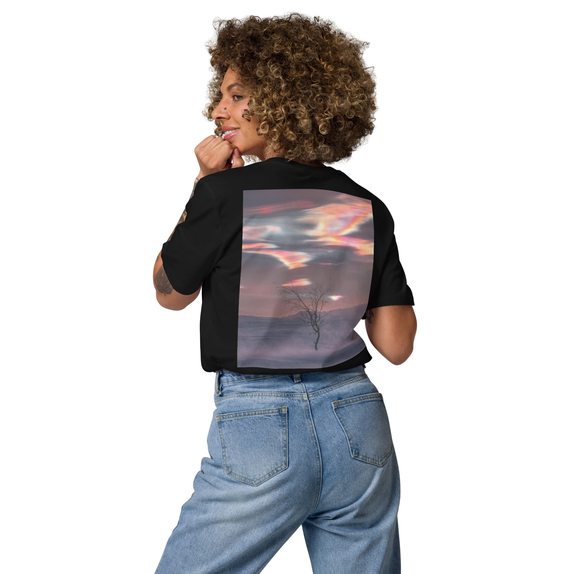 A model wearing a black sustainable organic cotton t-shirt featuring a stunning nacreous clouds graphic print on the back, offering a stylish eco-friendly streetwear solution.