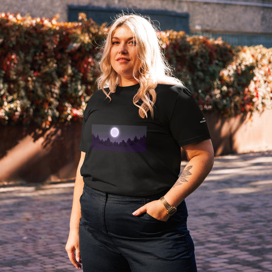Female model wearing the black Novapuro organic cotton t-shirt with a mystic purple forest and full moon print.