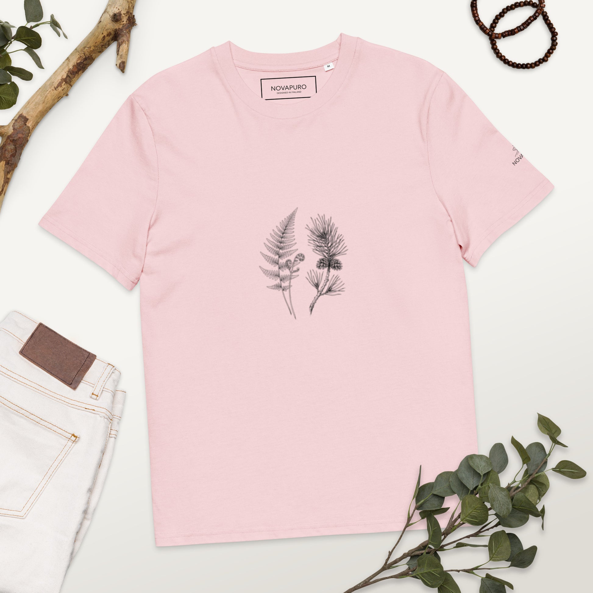 Minimalist line art illustration of a fern and pine branch on a soft pink Cotton Pink organic cotton t-shirt, representing sustainable Nordic fashion by Novapuro.