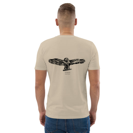Man wearing a sustainable beige organic cotton t-shirt, showcasing "The Threshold" Eagle Owl Nordic wildlife graphic on the back. Designed by Jarno Virtanen for ethical and comfortable everyday wear.