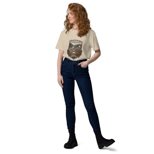 Model wearing a sustainable organic cotton t-shirt featuring a detailed vintage Wilderness Retreat illustration with a campfire, river, and pine forest.
