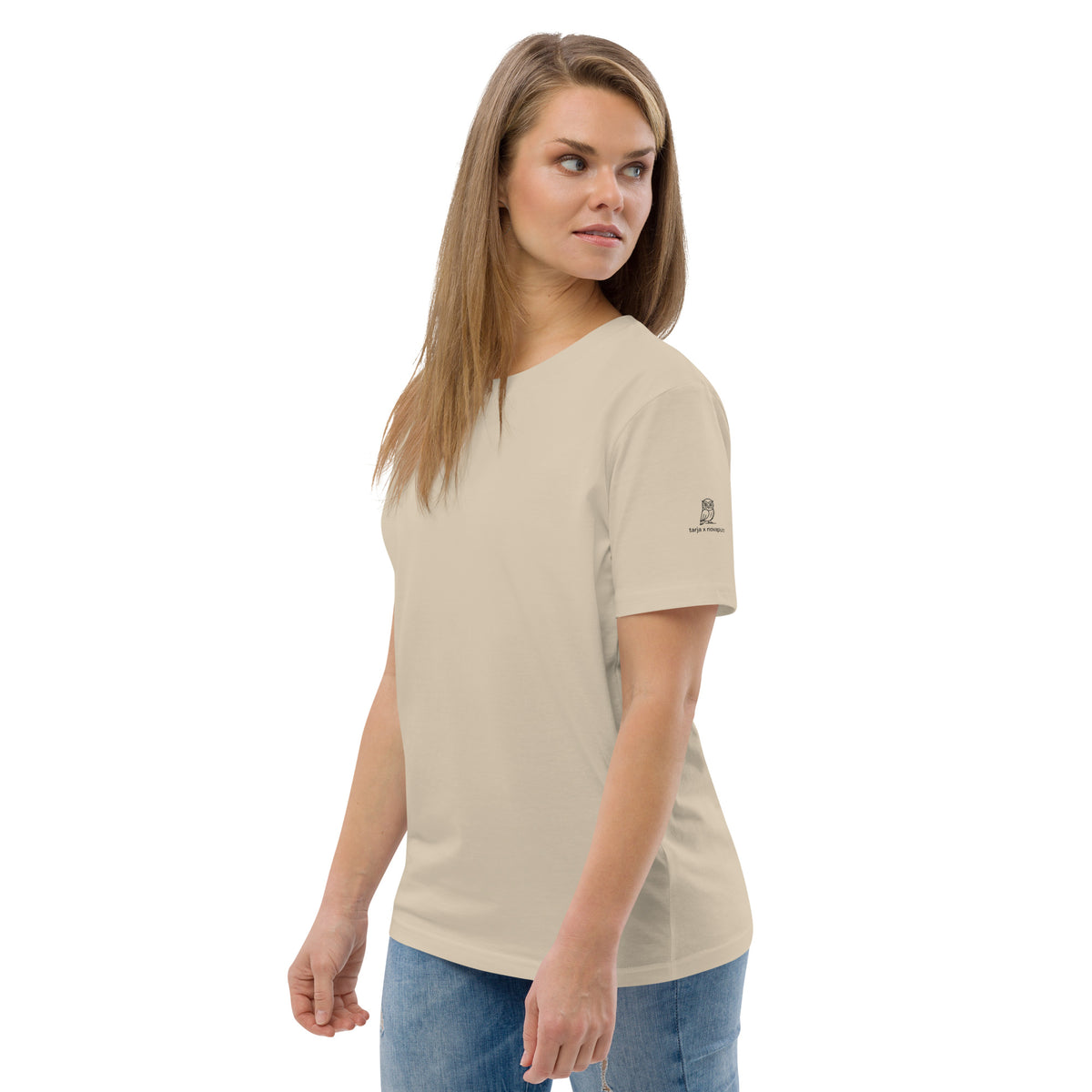 Eco-conscious fashion lover wearing the Tarja x Novapuro 100% organic cotton tee in a serene Finnish nature setting.