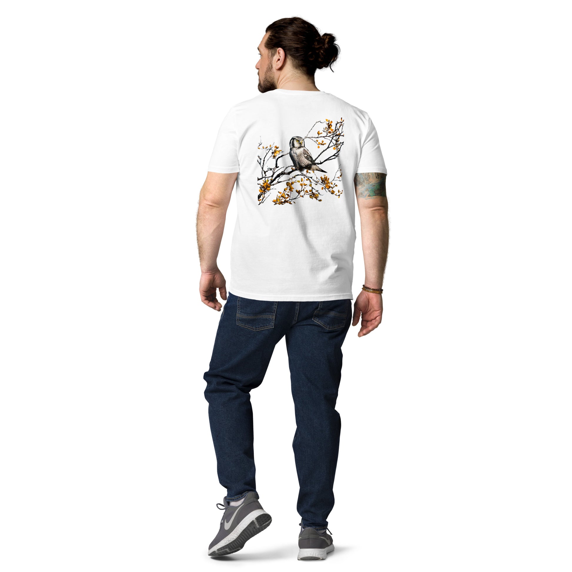 Back view of a female model wearing the white Jetro Luhtaa x Novapuro organic cotton t-shirt featuring a stunning Nordic owl back print.