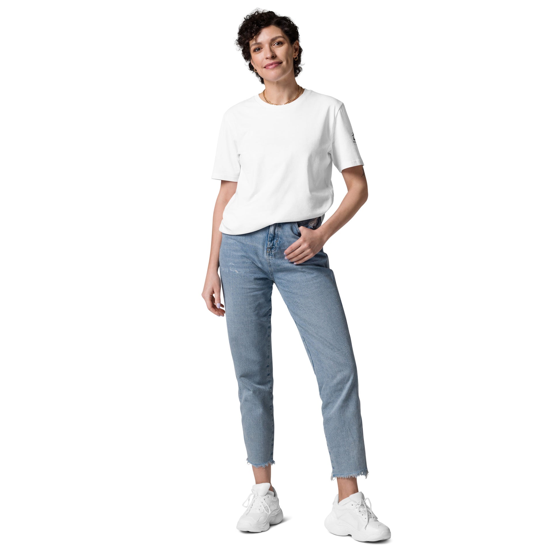 Woman posing in a comfortable and breathable white eco-friendly t-shirt made from premium organic cotton. Minimalist Scandinavian style for everyday wear.