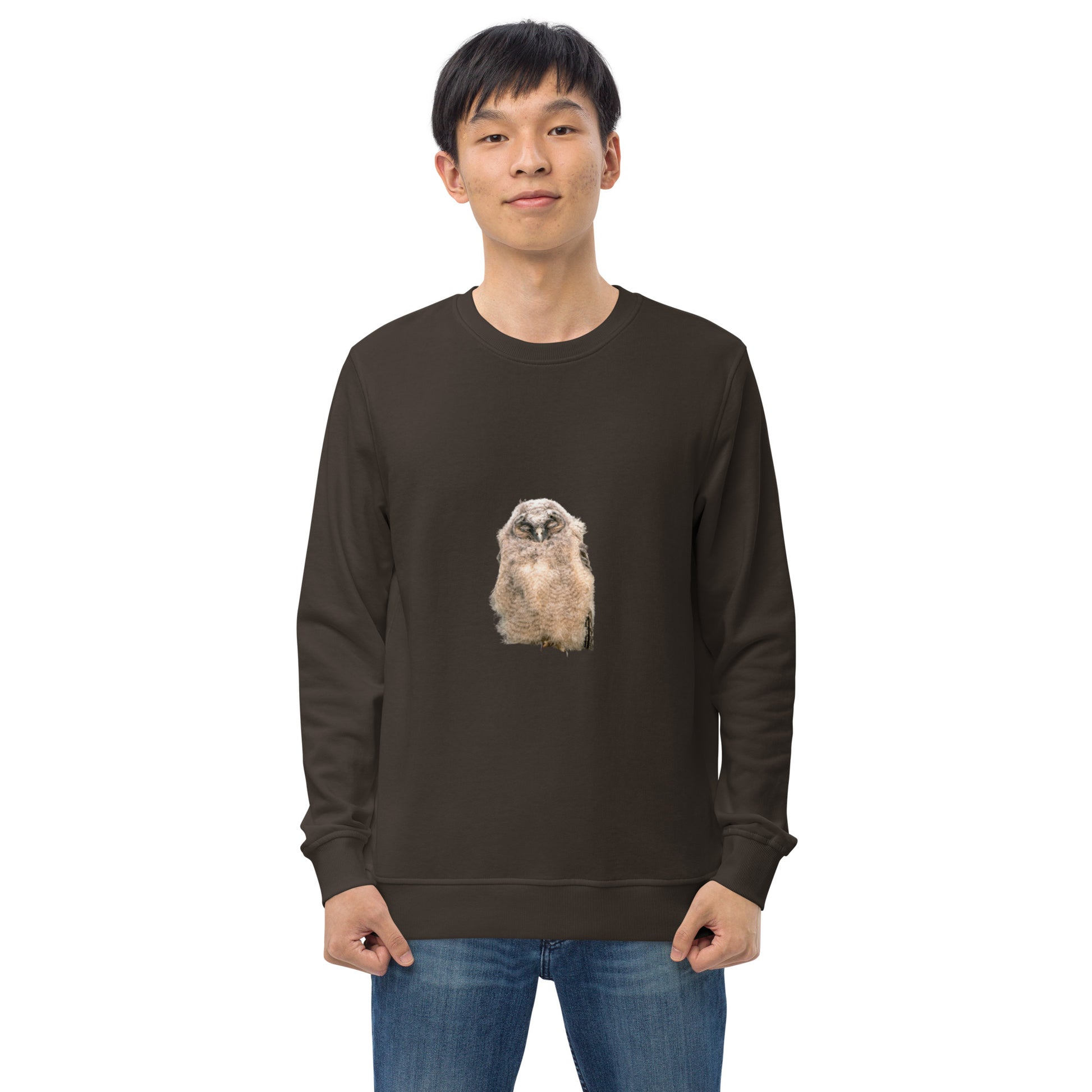 Front view of a model wearing a brown organic sweatshirt featuring a stippling art print of a Long-eared Owl by Mikko Monto.