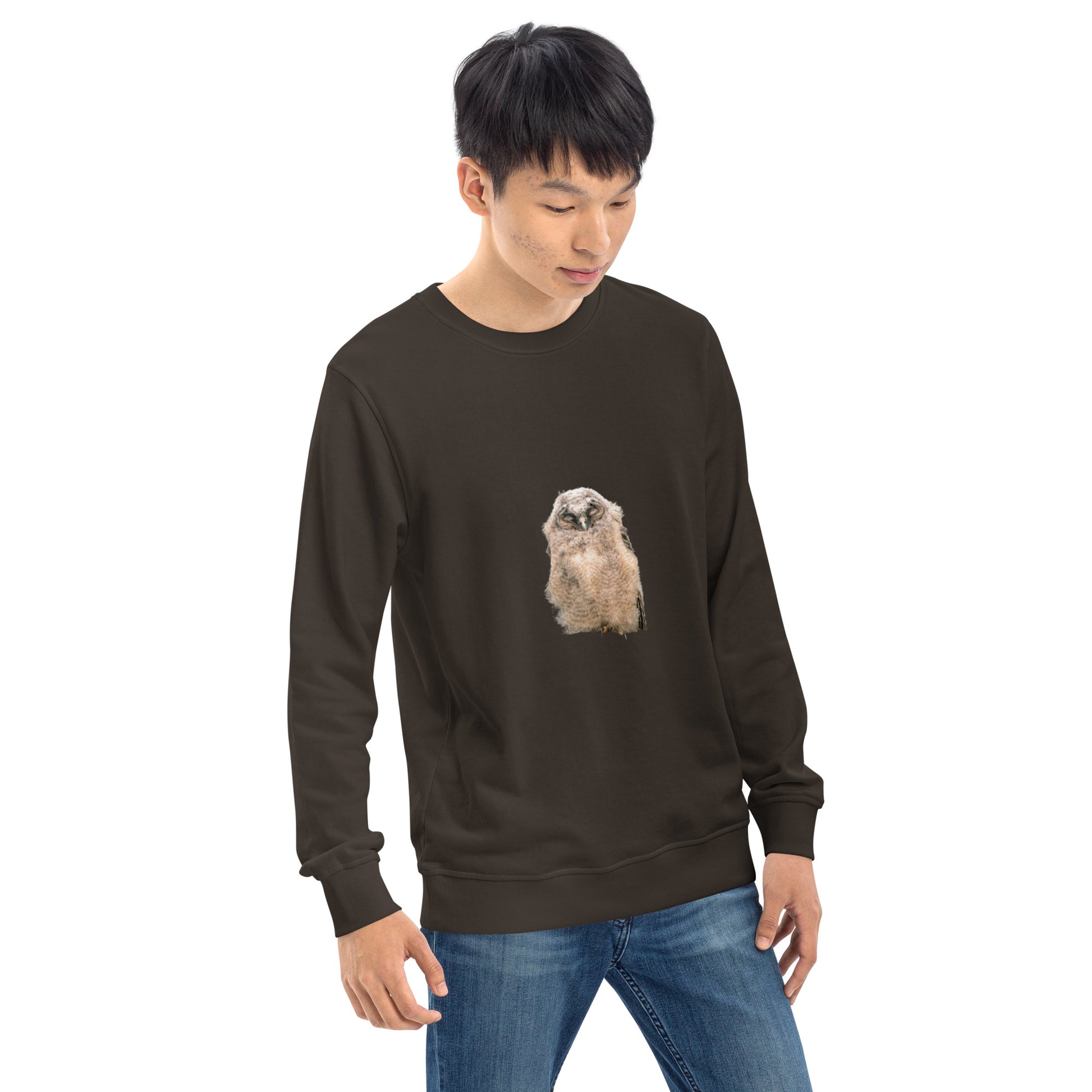 Angled front view of a model wearing a brown organic sweatshirt with a Long-eared Owl print.