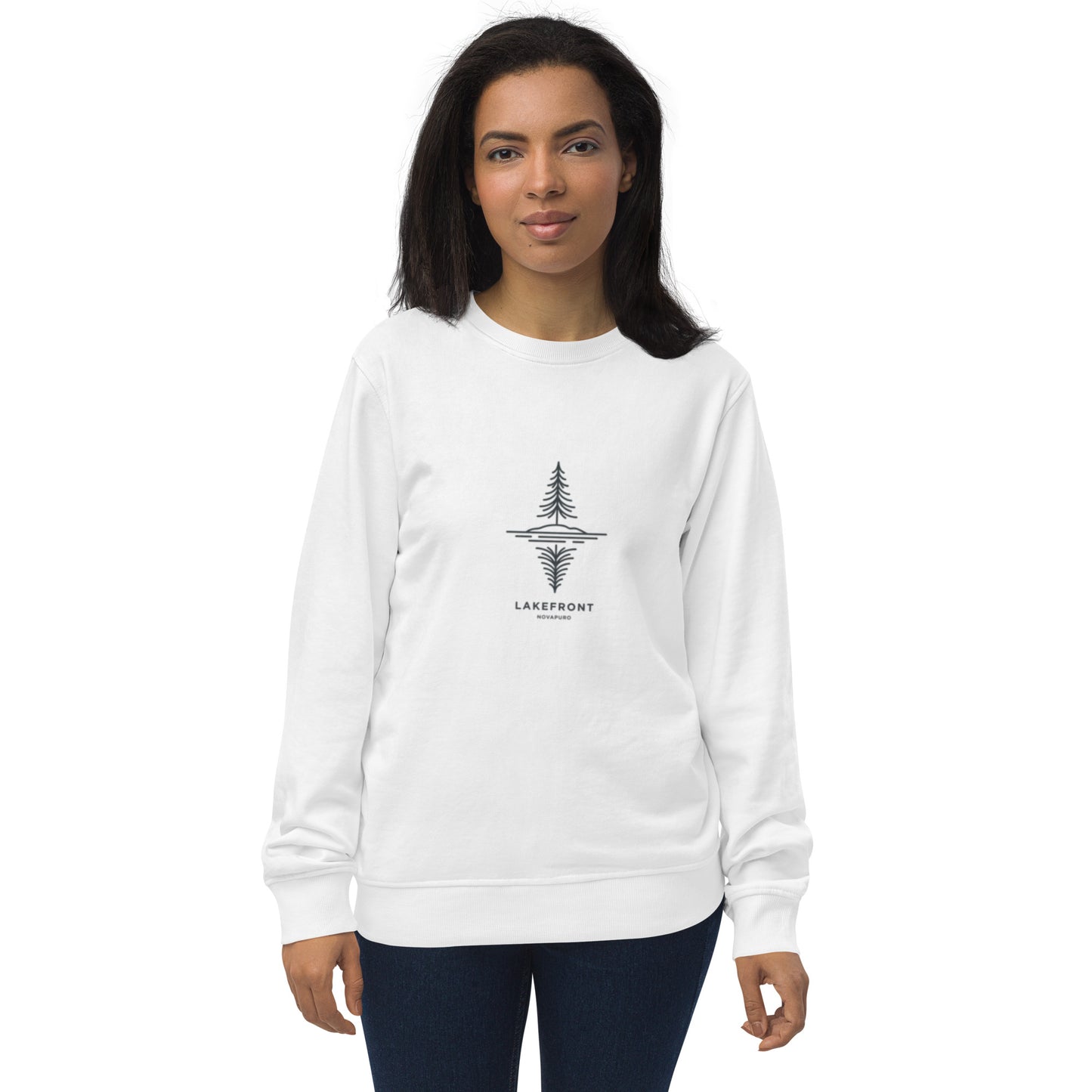 A model wearing a white premium organic sweatshirt featuring a minimalist line art illustration of a pine tree reflecting on a Nordic lake.