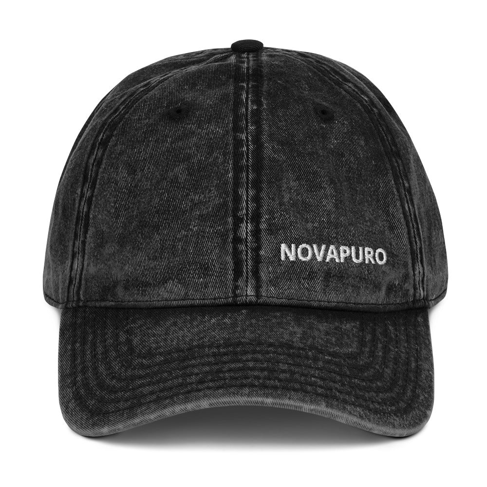 Novapuro "Legacy" Vintage Cap in distressed black cotton with embroidered logo. Unstructured dad hat with antique brass buckle.