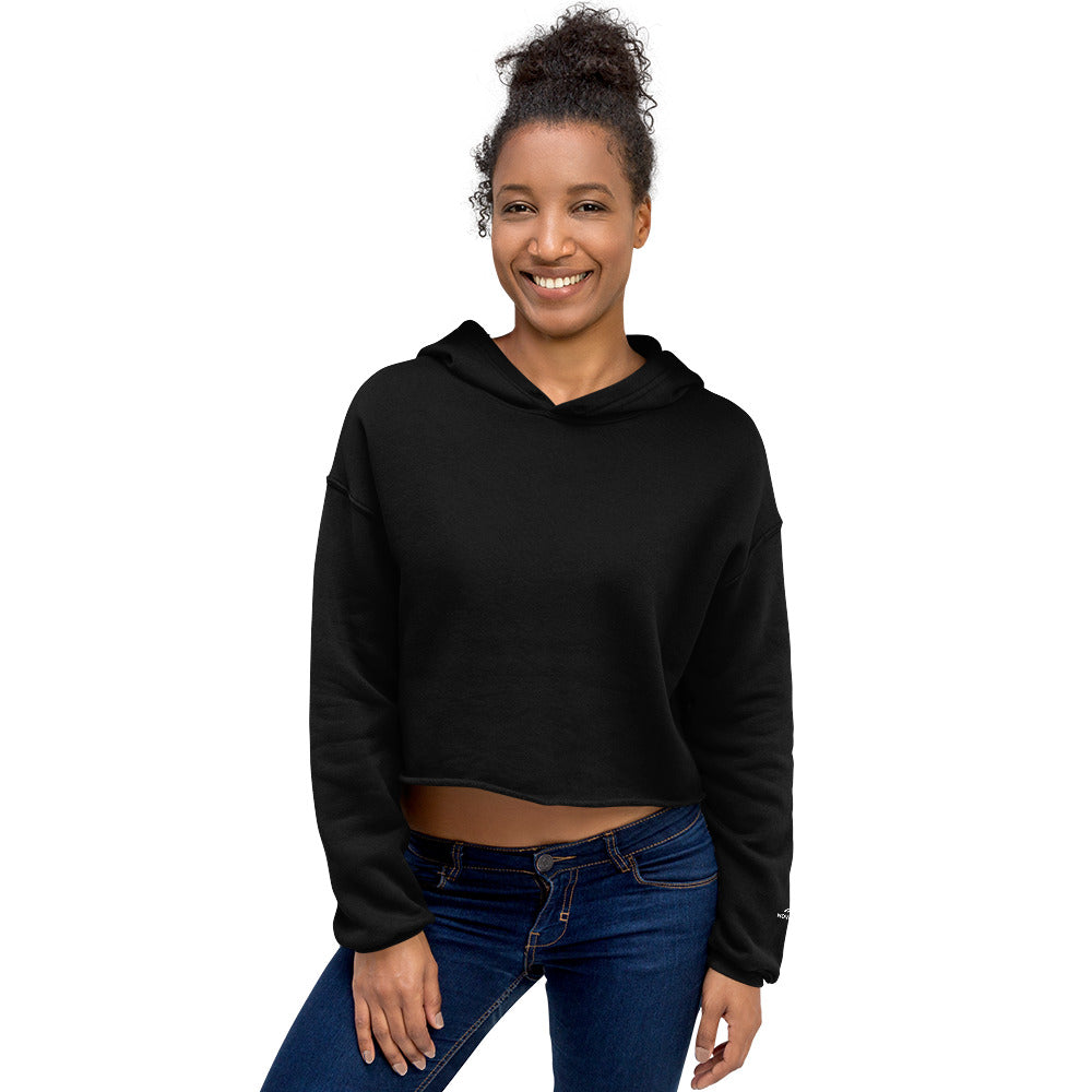 Woman wearing black Novapuro signature cropped hoodie with minimalist sleeve logo