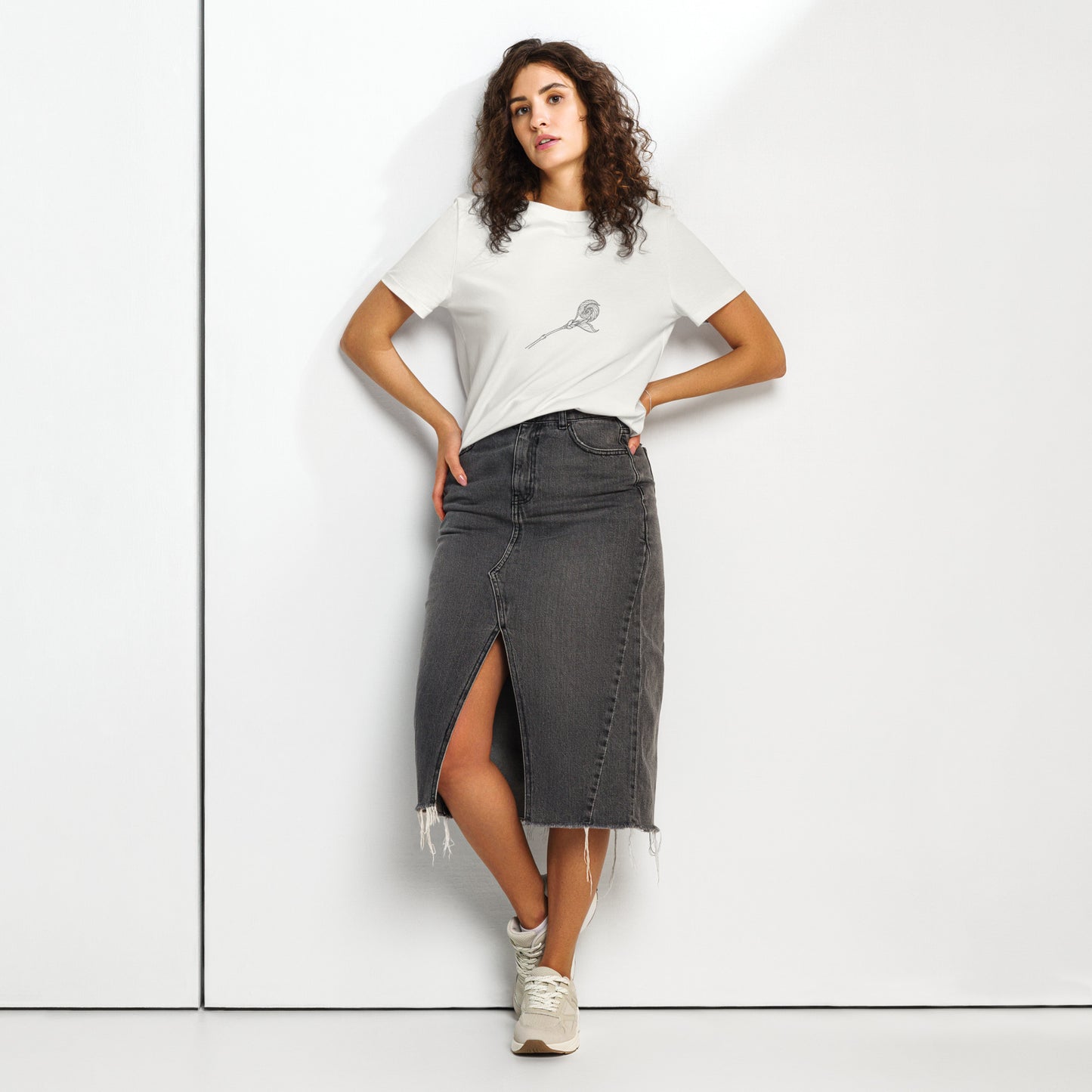 Model wearing a white organic cotton ribbed t-shirt with a minimalist spring bud graphic by Novapuro