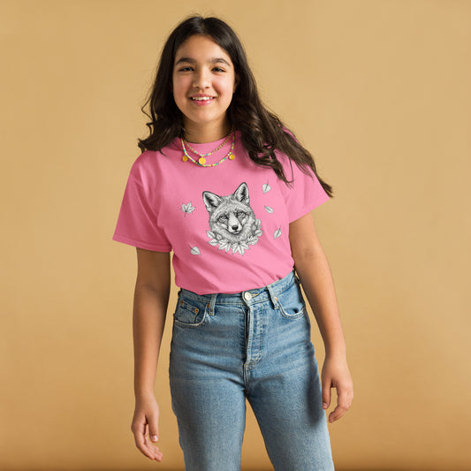 Smiling young girl wearing the sustainable pink Nordic Fox 100% cotton t-shirt from the Annette Thomé-Marttinen x Novapuro kids collection.